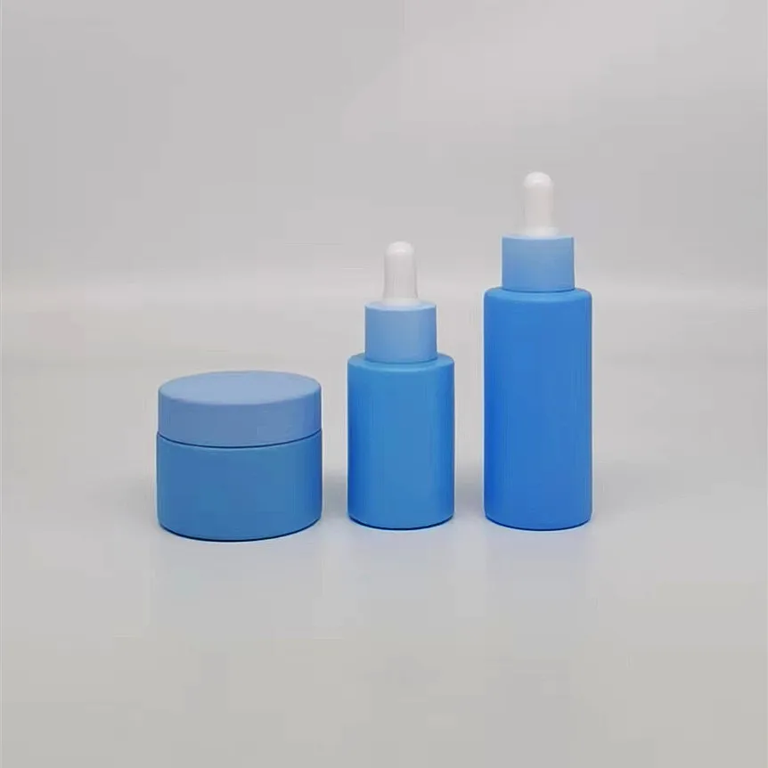 Low MOQ empty 30ml 1oz glass blue frosted cylinder glass essential oil dripping bottle rubber stopper