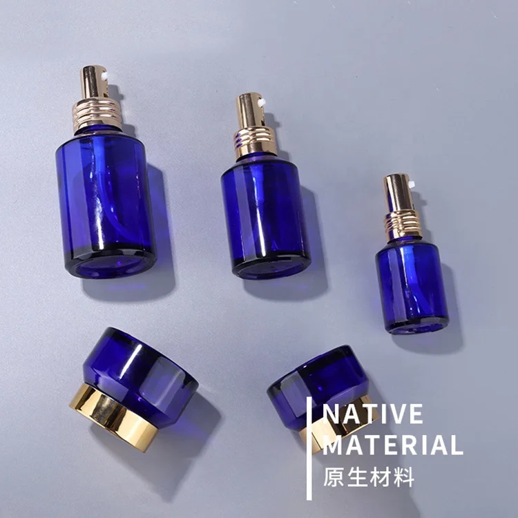 Inclined shoulder blue glass bottle 15 ml 30 ml 60 ml 100 ml 120 ml glass bottle and 15 g  30 g 50 g blue glass jar for cosmetic