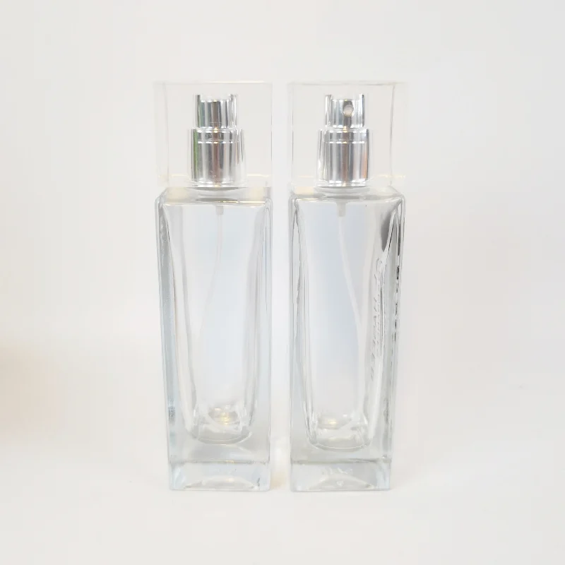 Transparent 50ml perfume bottles wholesale rectangular attar crystal bottle pump spray attar glass oil bottle