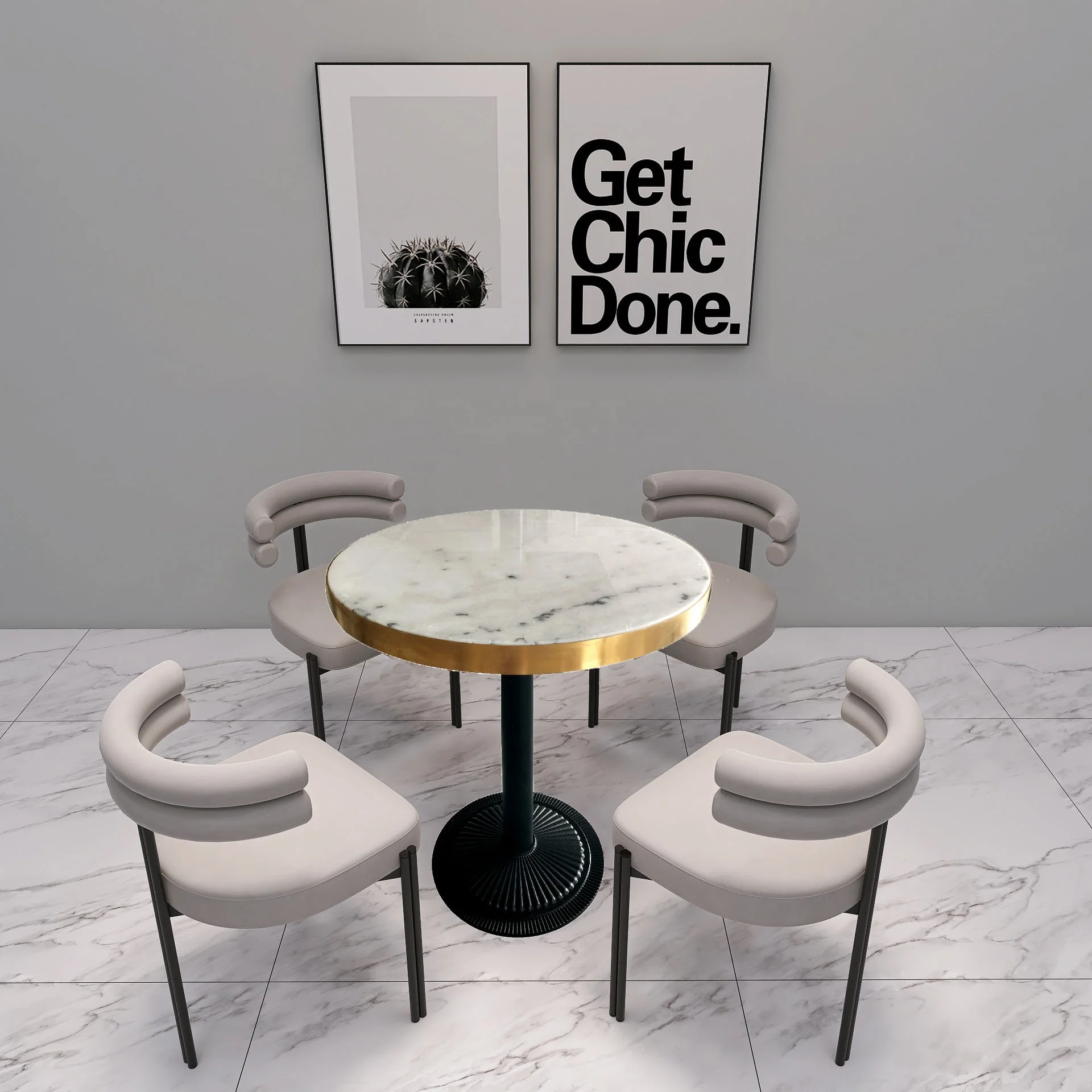 Фотография в мастерской золотая металлическая рамка металлические ножки круглый мраморный журнальный столик