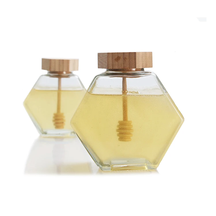 Hot Selling Honey Jars Glass Unique Hexagon Shape Transparent Container with Wooden Honey Spoon and Bamboo Lids Packaging