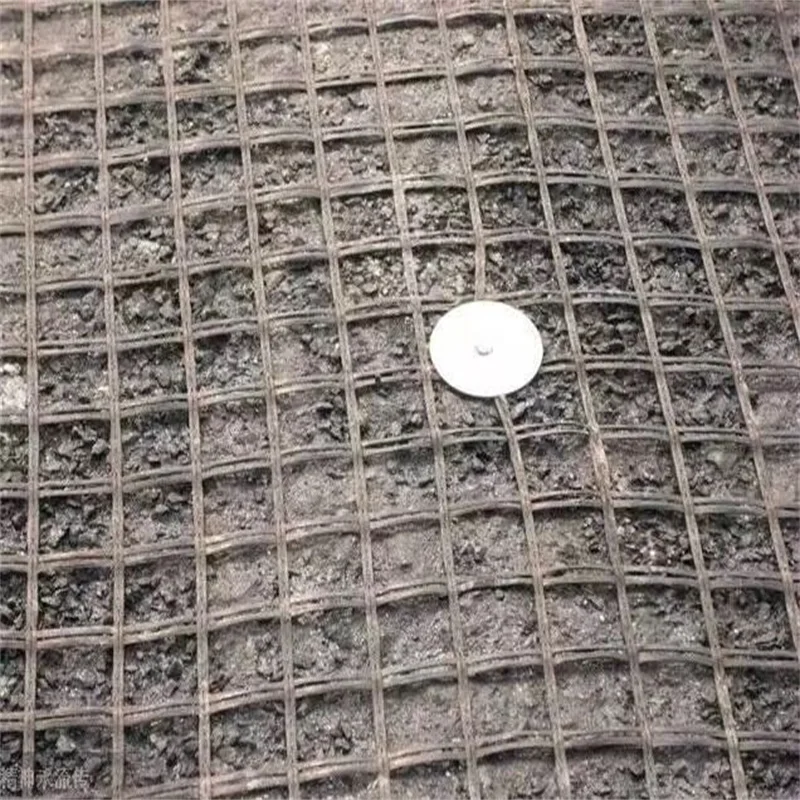 luming company  fiberglass, polyester, basalt  Self-adhesive fibreglass geogrid 100kn  composite are used for road construction.