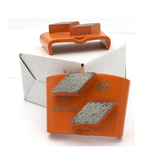 Quick replacement of diamond shaped concrete floor grinding shoes with HTC back cover