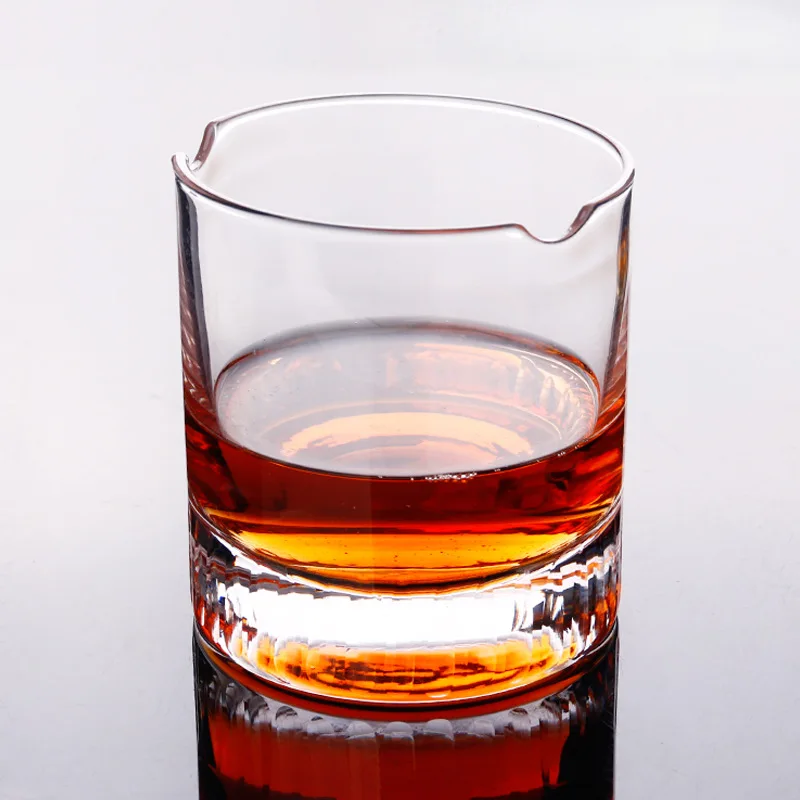 Cigar holding whiskey glass