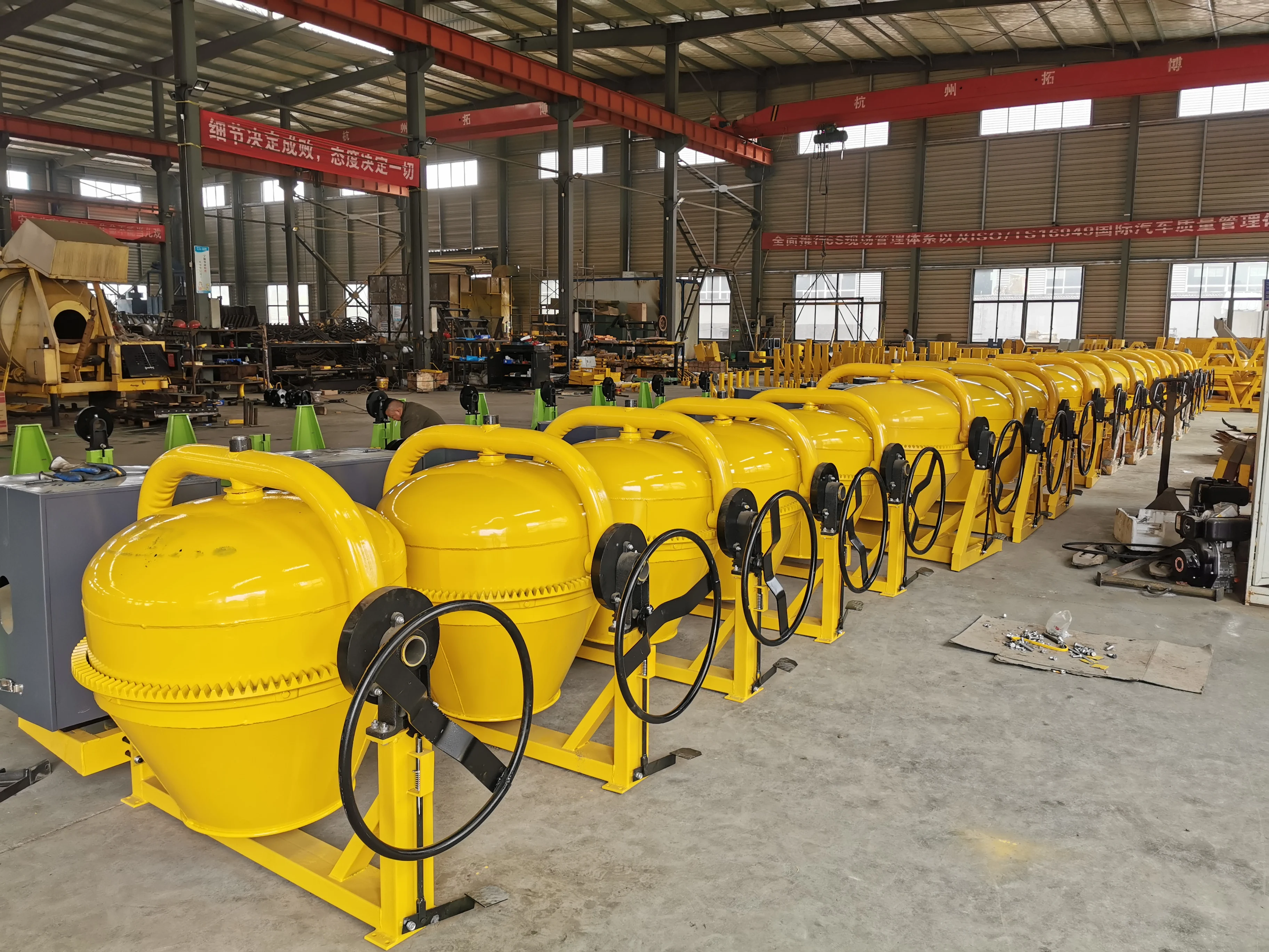 350L Self-Loading Concrete Mixer with 2 Wheels, Mounted and Self-Discharging Capability for Efficient Mixing and Transport.