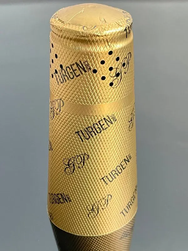 Decorative made of aluminum foil capsule for champagne