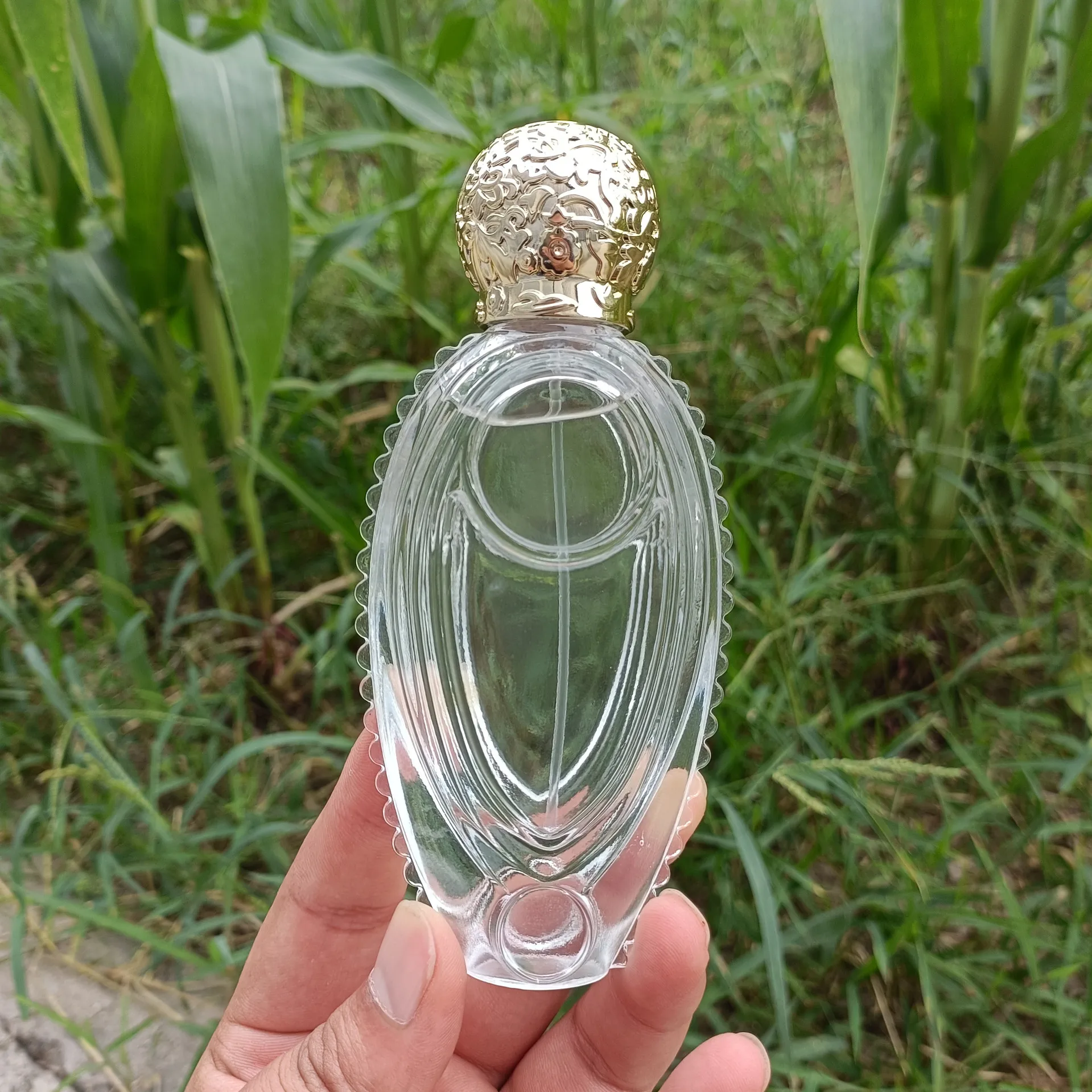 custom premium fancy perfume glass bottle portable refillable perfume atomizer bottle exotic fish perfume bottle with gold cap