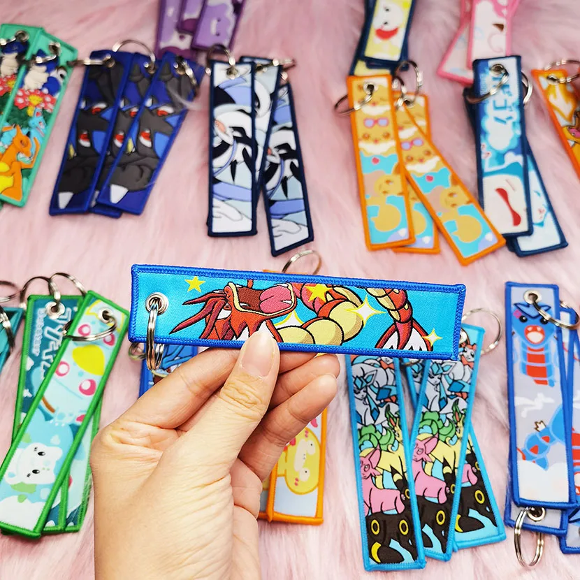 Factory Custom Wholesale Motorbike Car Anime Woven Embroidered Key Chain Tag Design Logo Fabric Embroidery Keychains