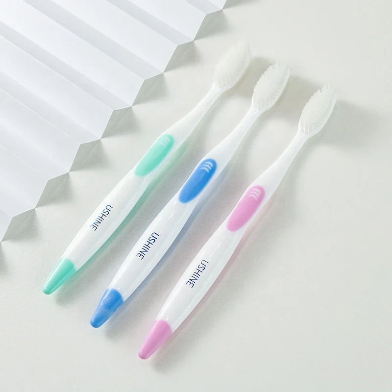 High quality ISO CE ROHS  approved massage gum adult travel toothbrush  Wholesale OEM free sample Customized Ushine 658