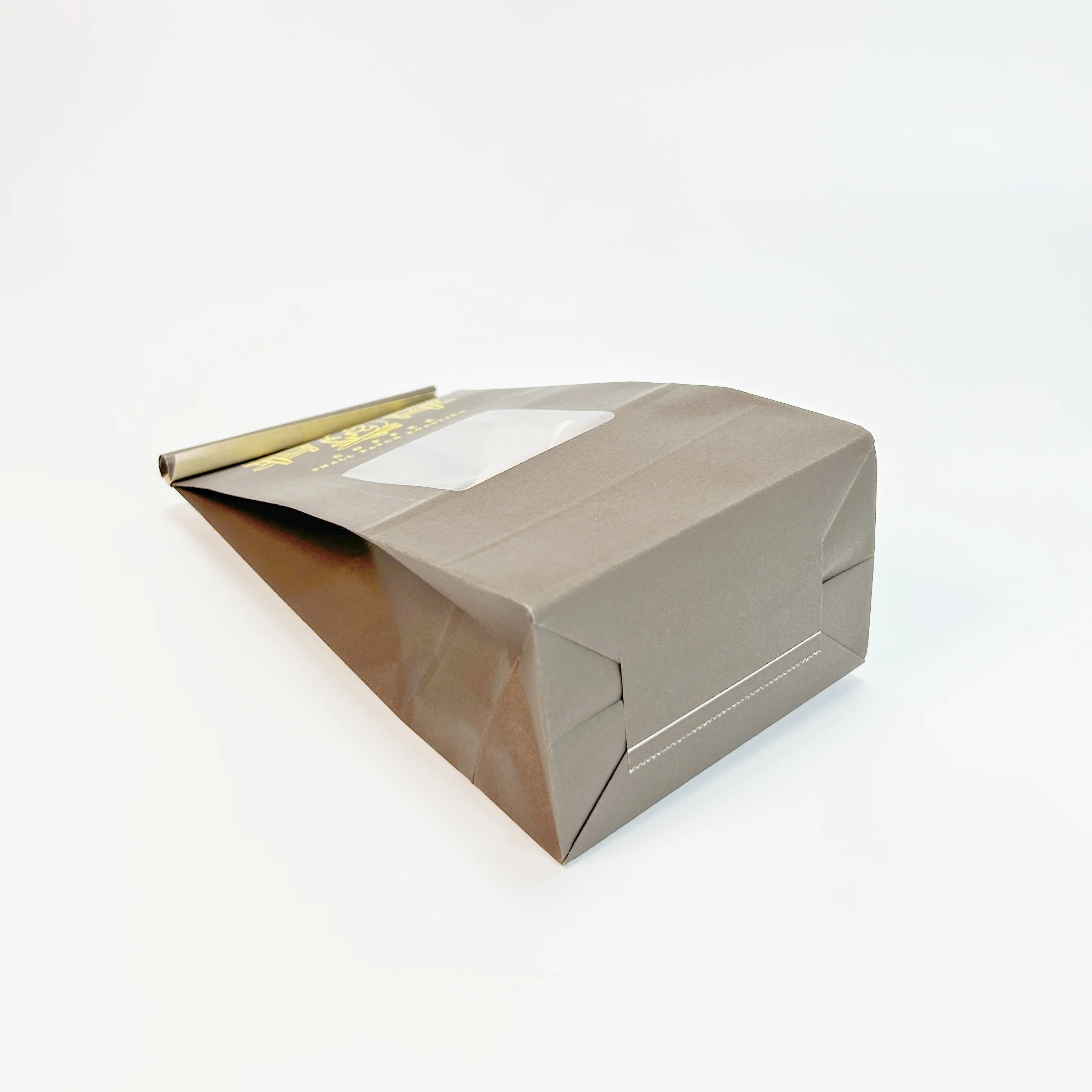 Tea bag Brown greaseproof paper cellophane tape tin tie Open clear window Food storage packaging kraft paper