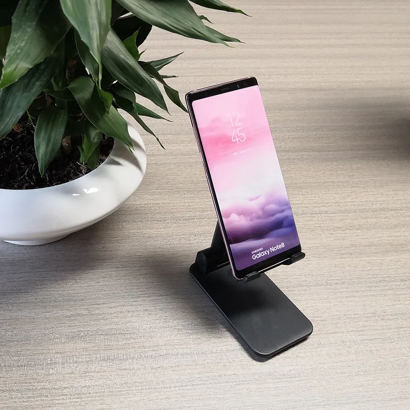 Adjustable Cell Phone Stand Desktop Cellphone Stand with Anti-Slip Base and Convenient Charging Port Fits All Smart Phones