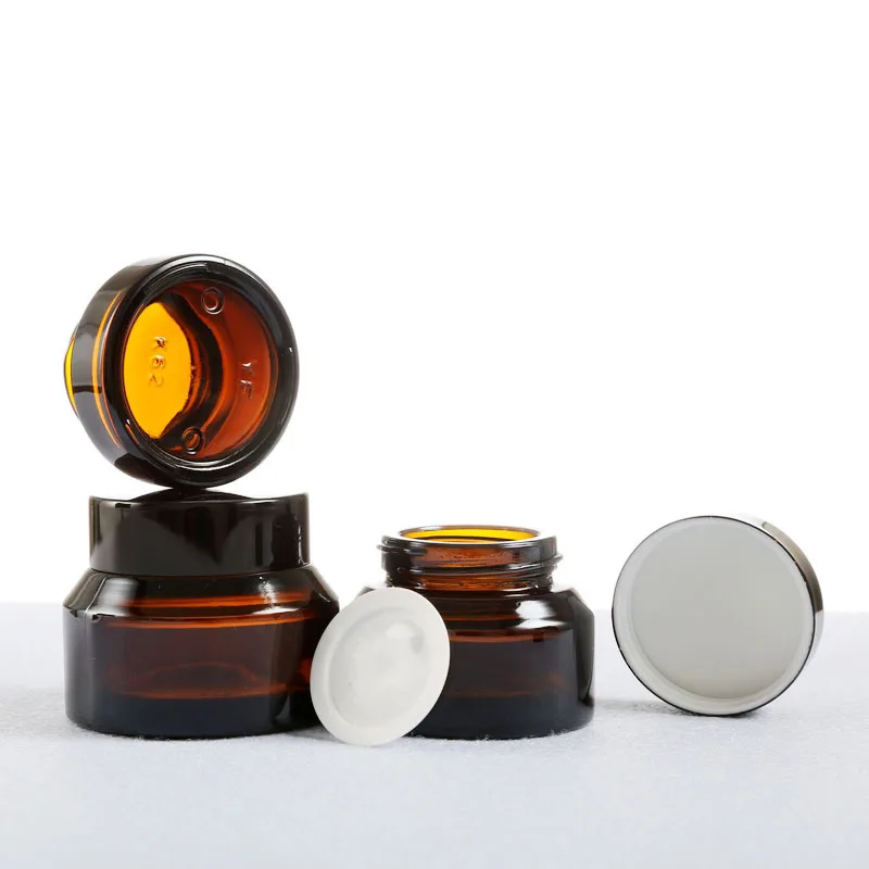 
sloping shoulder jar frosted olive green glass jar cosmetics cream skincare packaging 