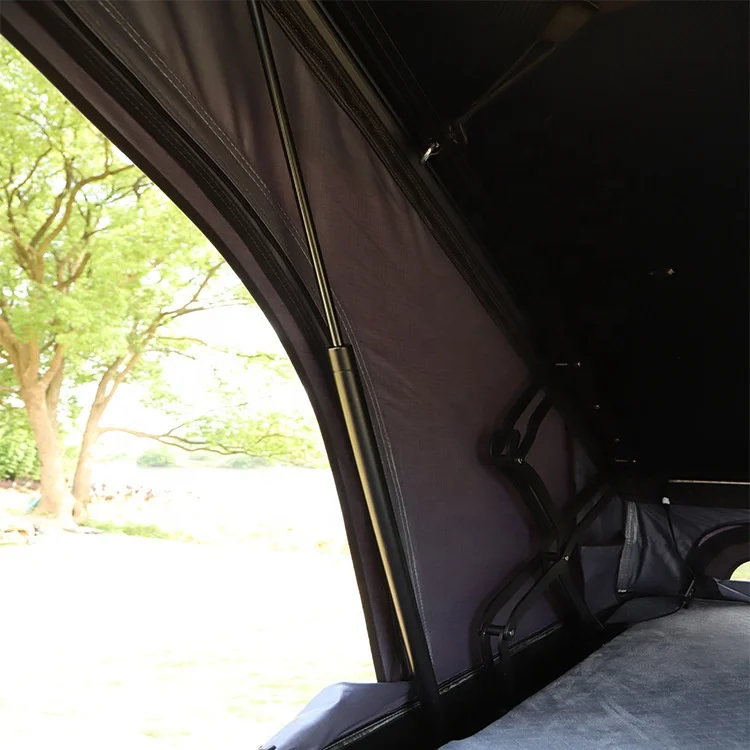 Outdoor self driving camping roof tent with large black glue aluminum shell triangular roof tent inside