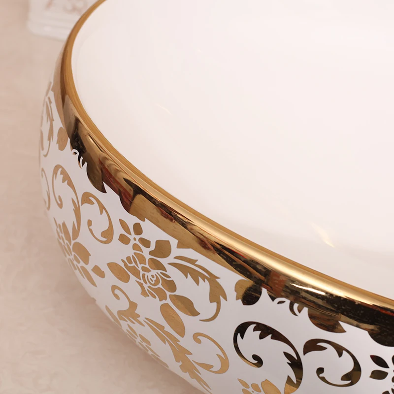Gilded Elegance Oval Shaped Basin with Intricate Gold Designs for a Luxurious Bathroom ceramic art wash basin counter top sinks