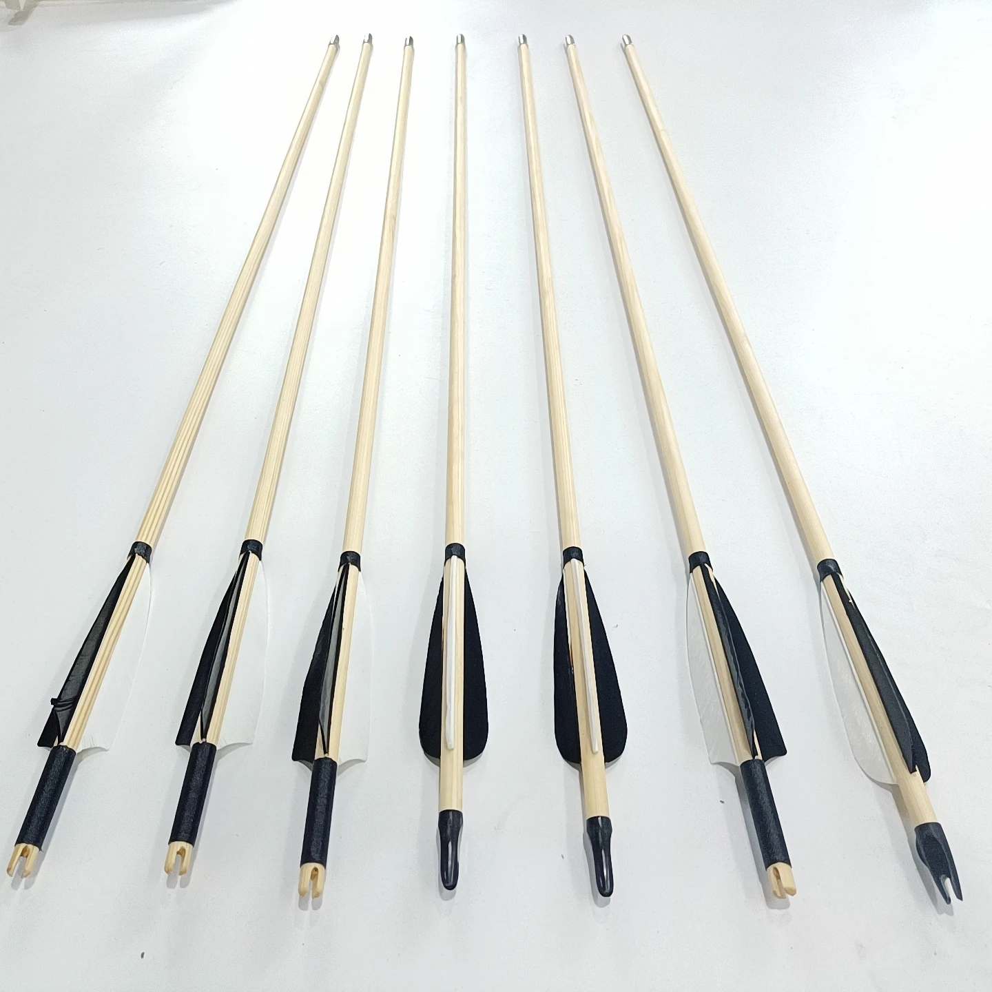 hunting wood arrows handmade wooden arrow shafts white and black plain feathers silver arrow tips archery traditional  hunting