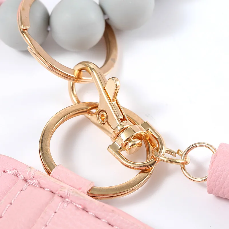 2021 Hot Sale Silicone Pu Lady Purse With Tassel Beaded Bracelet Keychain With Tassel