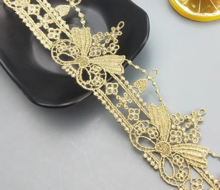 wholesale 5cm polyester golden hollowed out embroidery bow lace trim guipure fabric for wedding dresses garment JDB65