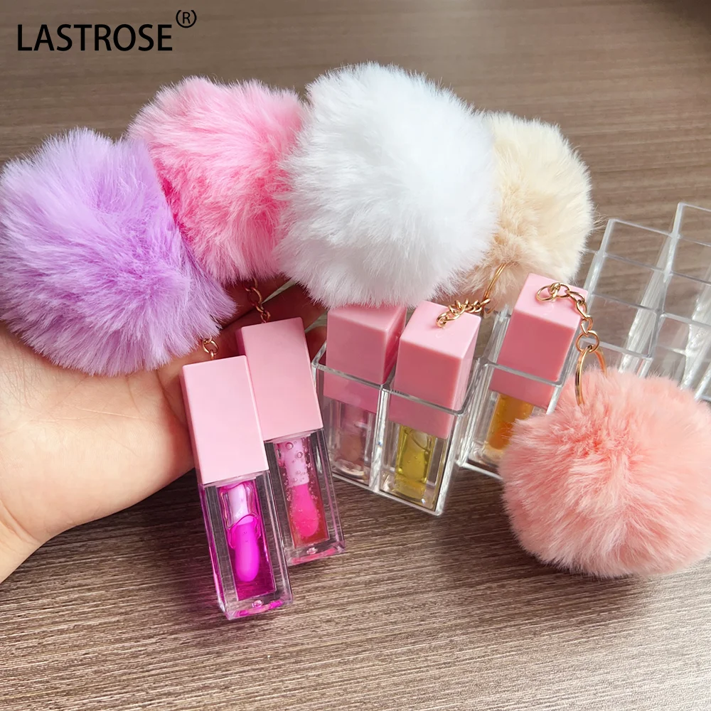 Wholesale Watermelon Lip Plumping Brown Tinted Lip Glow  Coconut Oil Flavouring pink Lip Oil with Pompon Private Label