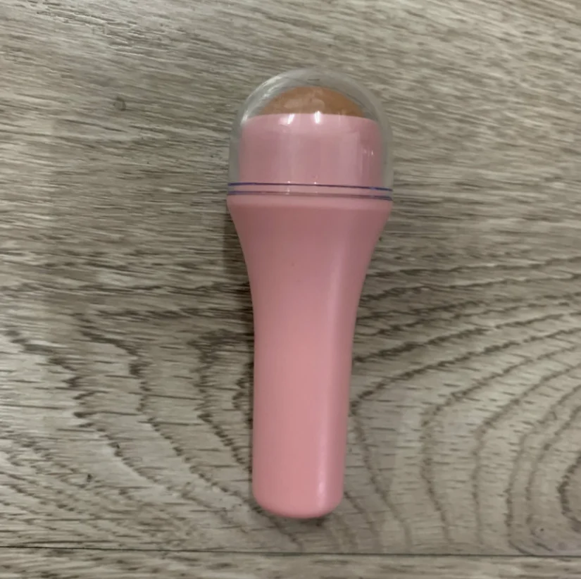 Hot selling high quality natural volcanic stone oil absorption roller facial massage clean skin care tool