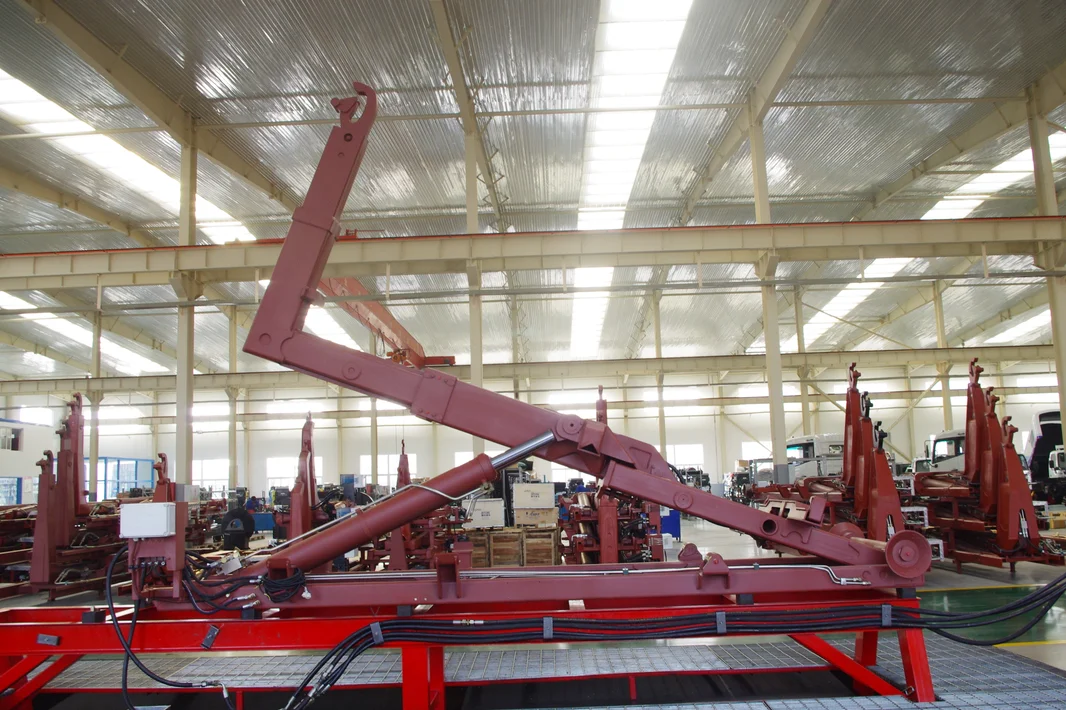 Hydraulic hook lift hoist mounted on heavy duty trucks designed for  transportation of materials in the waste, recycling, scrap