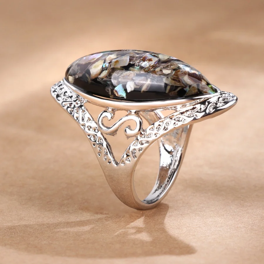 
Wholesale retro magic color shell ring alloy ancient silver carved big ring couple models 