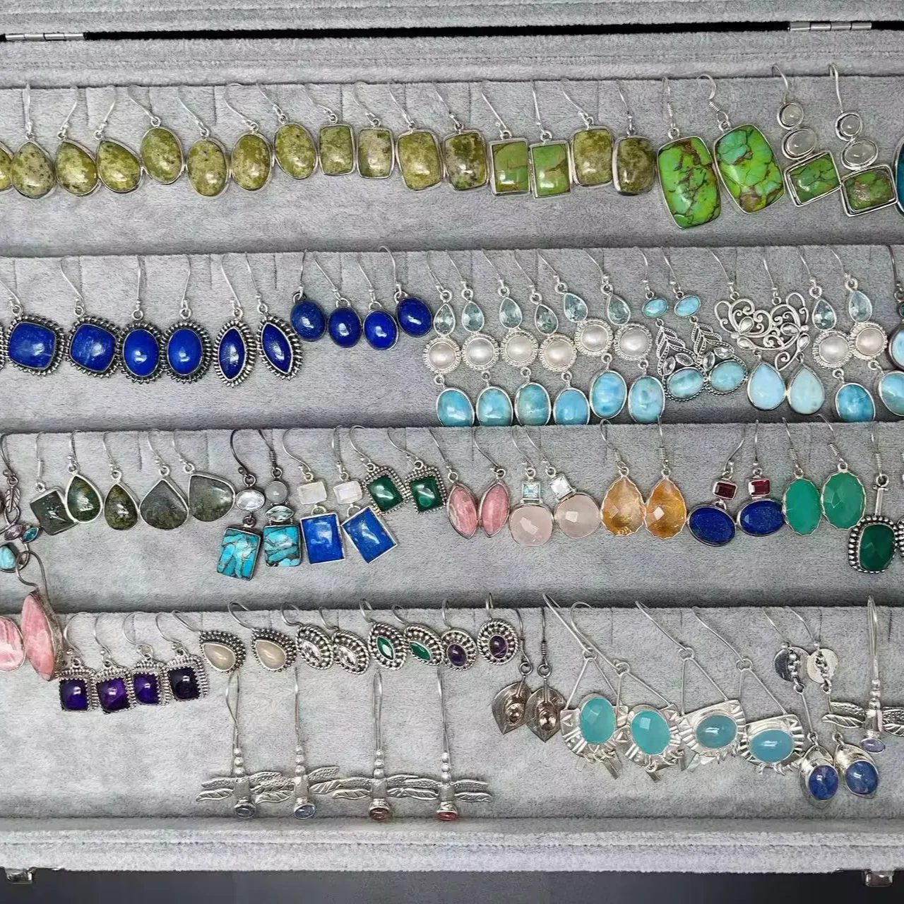 Exquisite handmade earrings with natural colored gemstones, classic silver inlay and fashionable design