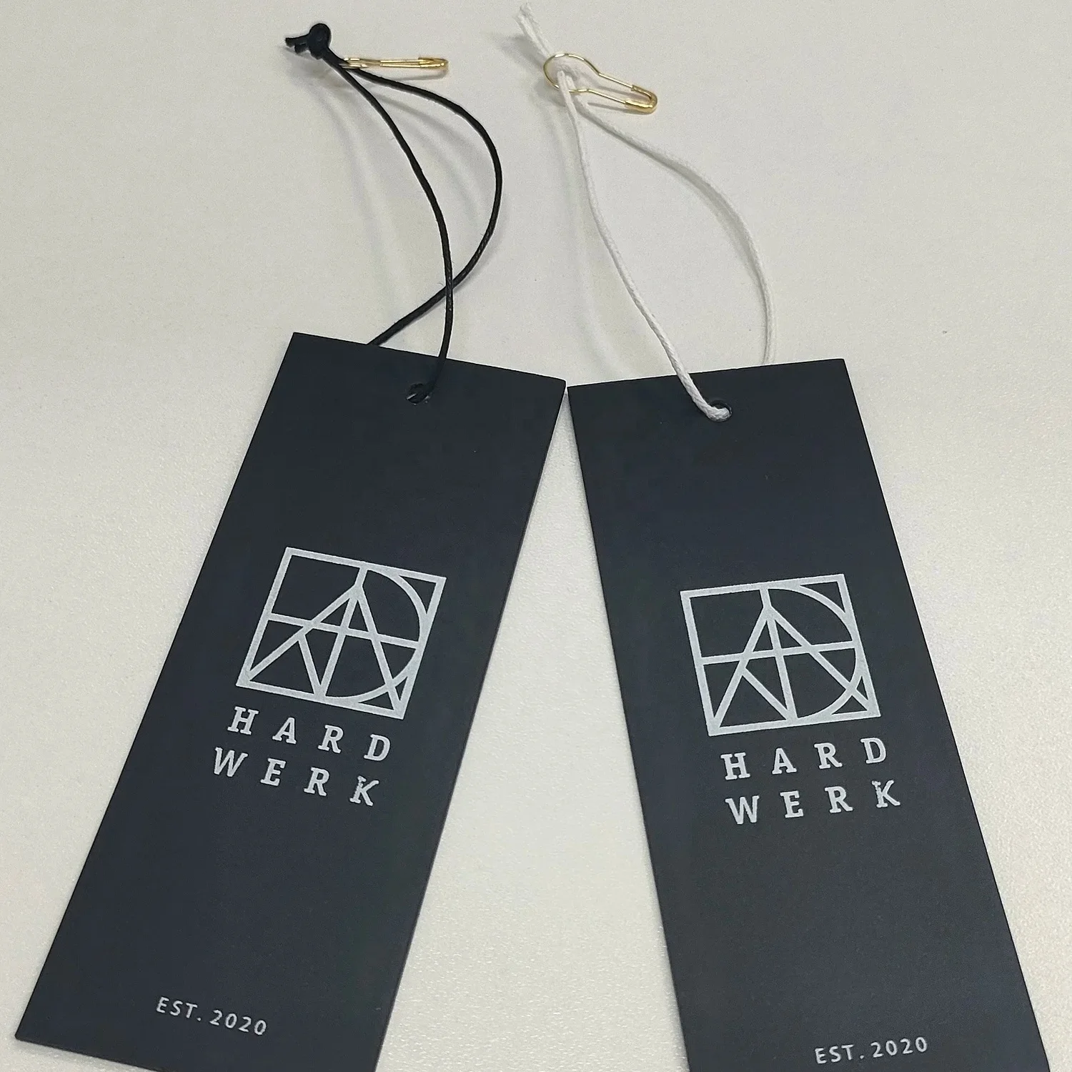 Customized luxury clothing tags clothing labels with printed name logo plastic tags with rope paper tags backpacks own logo