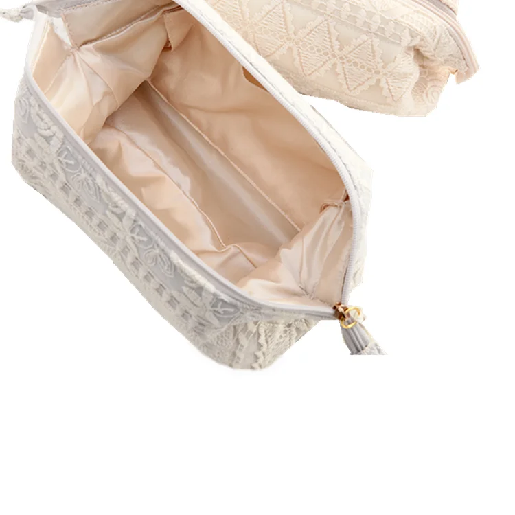 Wholesale China suppliers custom design satin lace bag packaging silk luxury packing bag with tassels and zipper for makeup