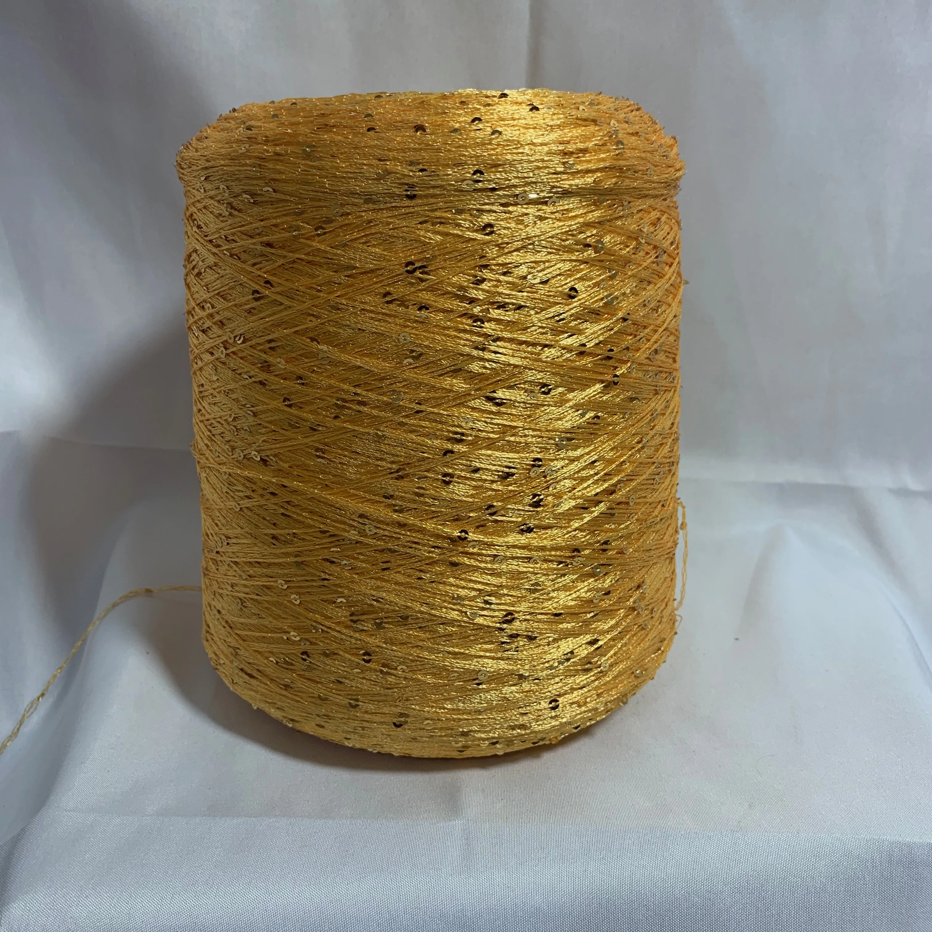 Bright hot selling Russian gold sequin yarn  5.5nm 3mm sequins  polyester crochet eyelash yarn crewneck textile yarn