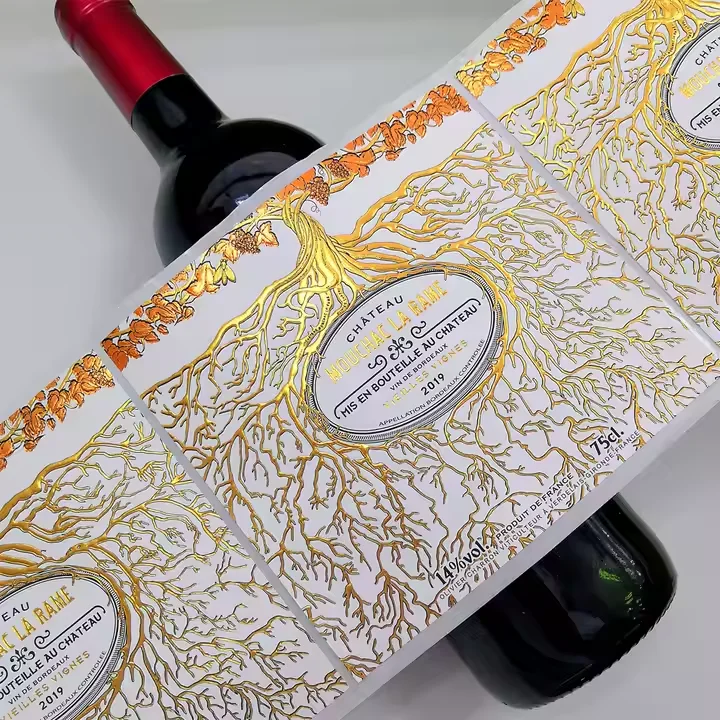 Luxury Embossed Rose Gold Foil Bottle Printing Labels for Custom Red Wine, Champagne, and Fancy Sparkling Water Packaging.