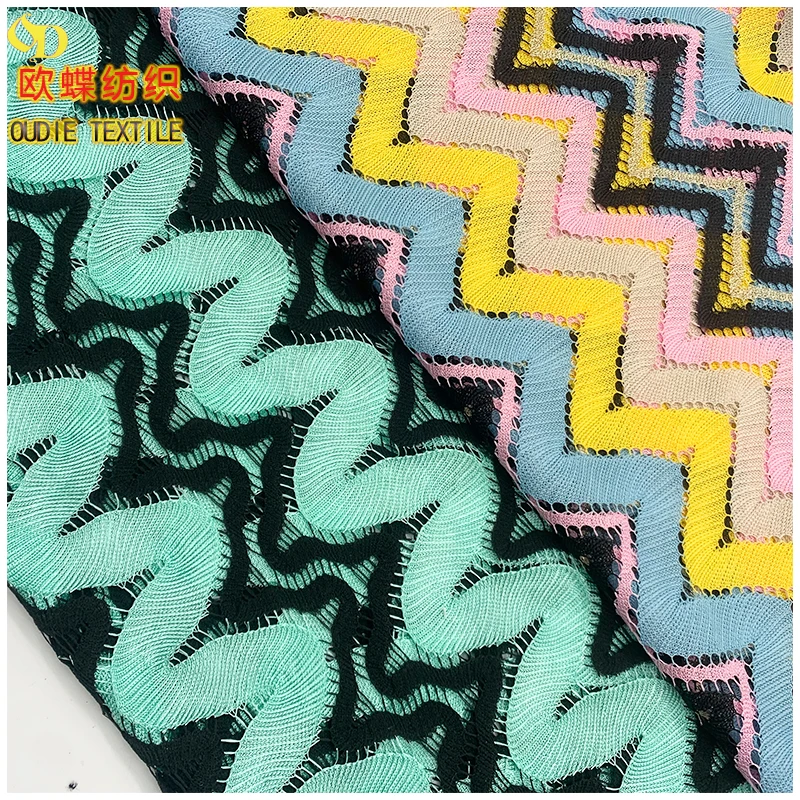 The manufacturer directly provides polyester yarn dyed blended polyester bright silk mesh knitted clothing fabric