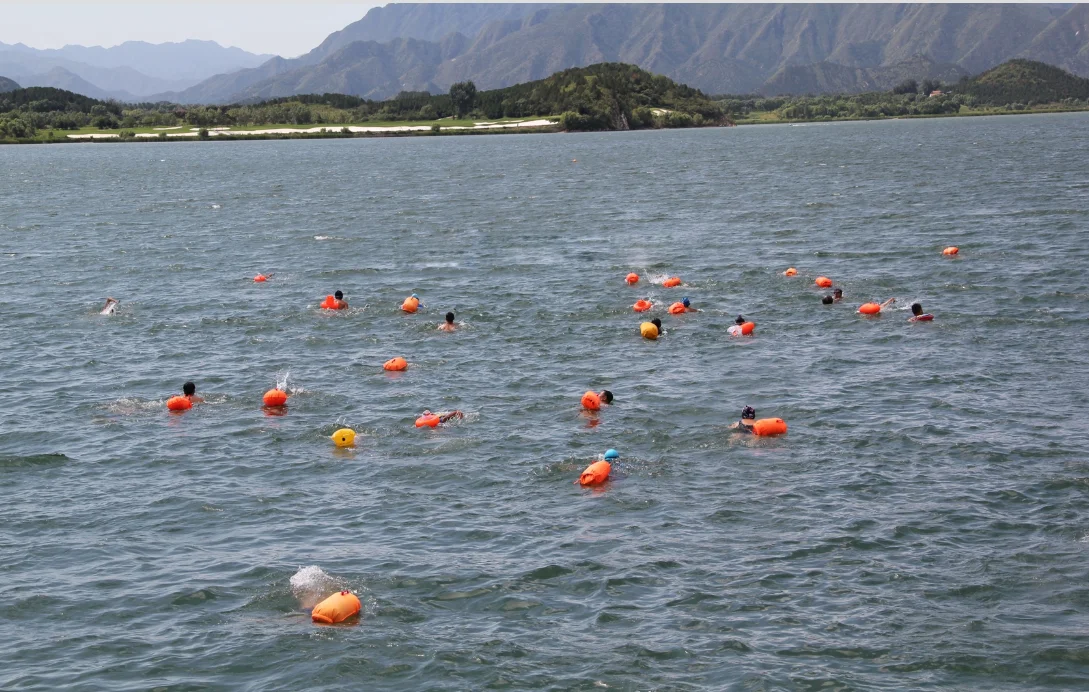 Yufeng factory high quality fee design logo 8kg + instructions inflatable life saving swim bouy float for swimmer sport