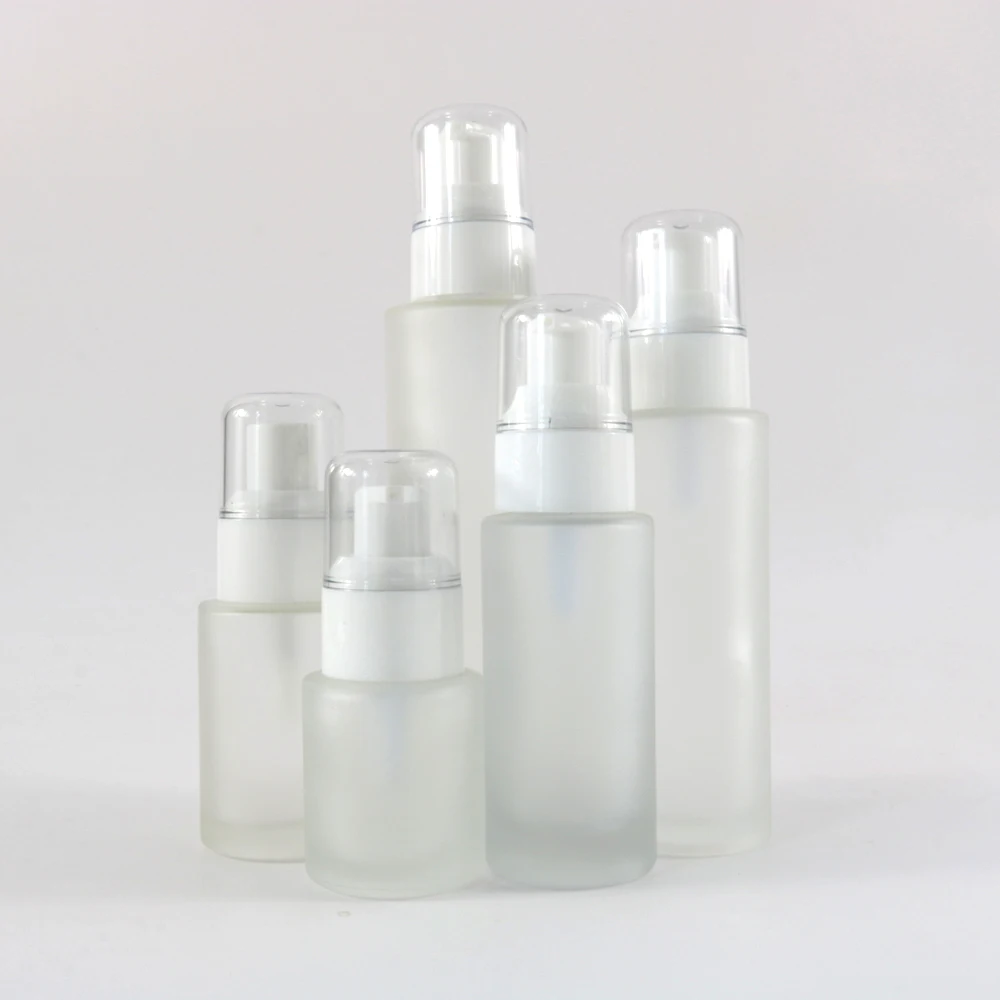 Cosmetic clear frosted glass flat shoulder bottle with white white pump