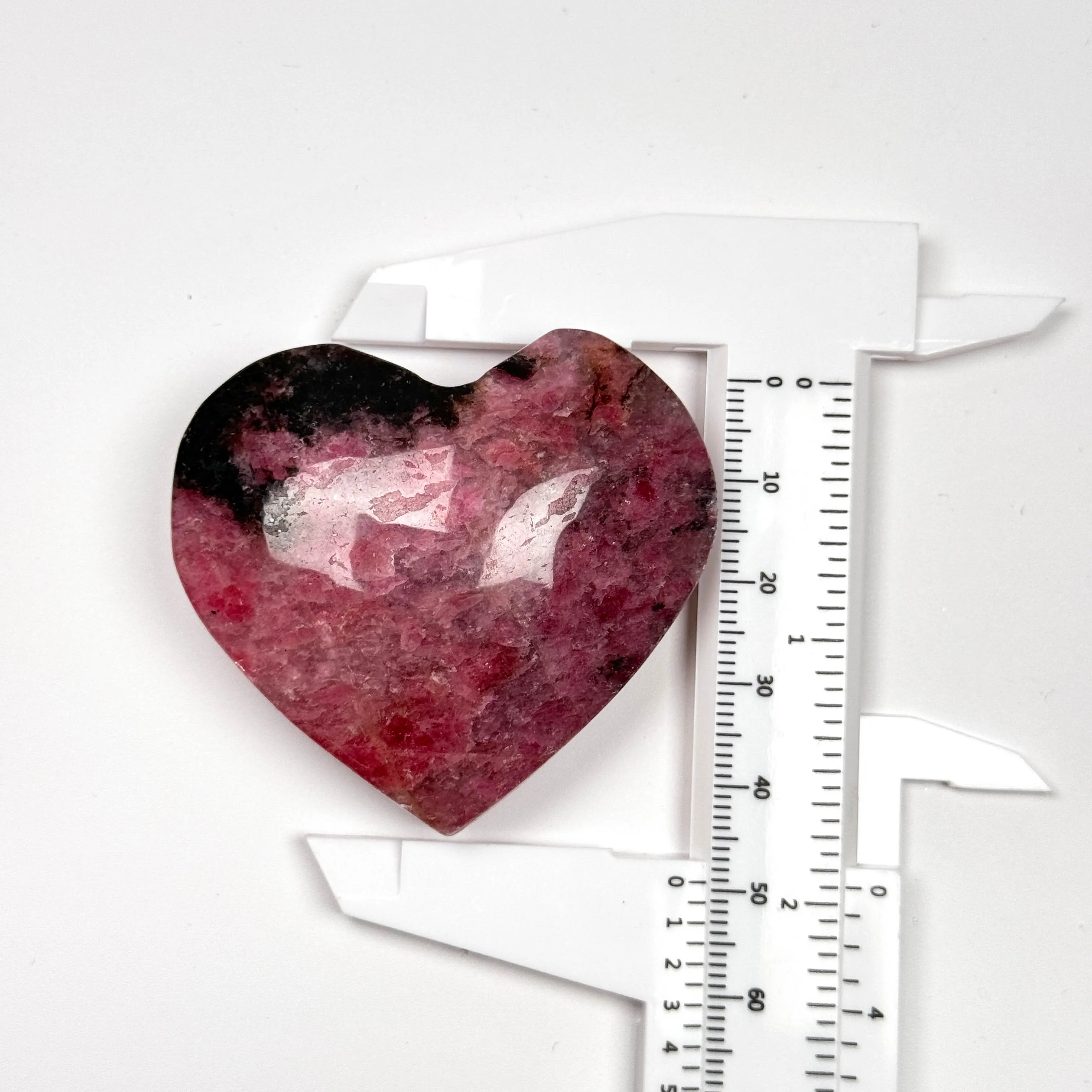 Wholesale Polished Carved Black Rhodonite Reiki Palm Stones Healing Crystal Polished Palm Stones For 7 Chakra Crystals