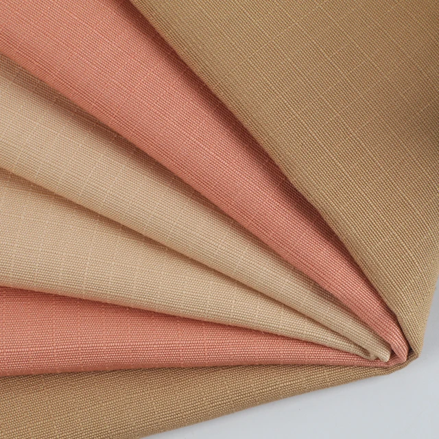 Wholesale plain-dyed woven thick strand beaded canvas lattice 100% cotton fabric for coat pants bags