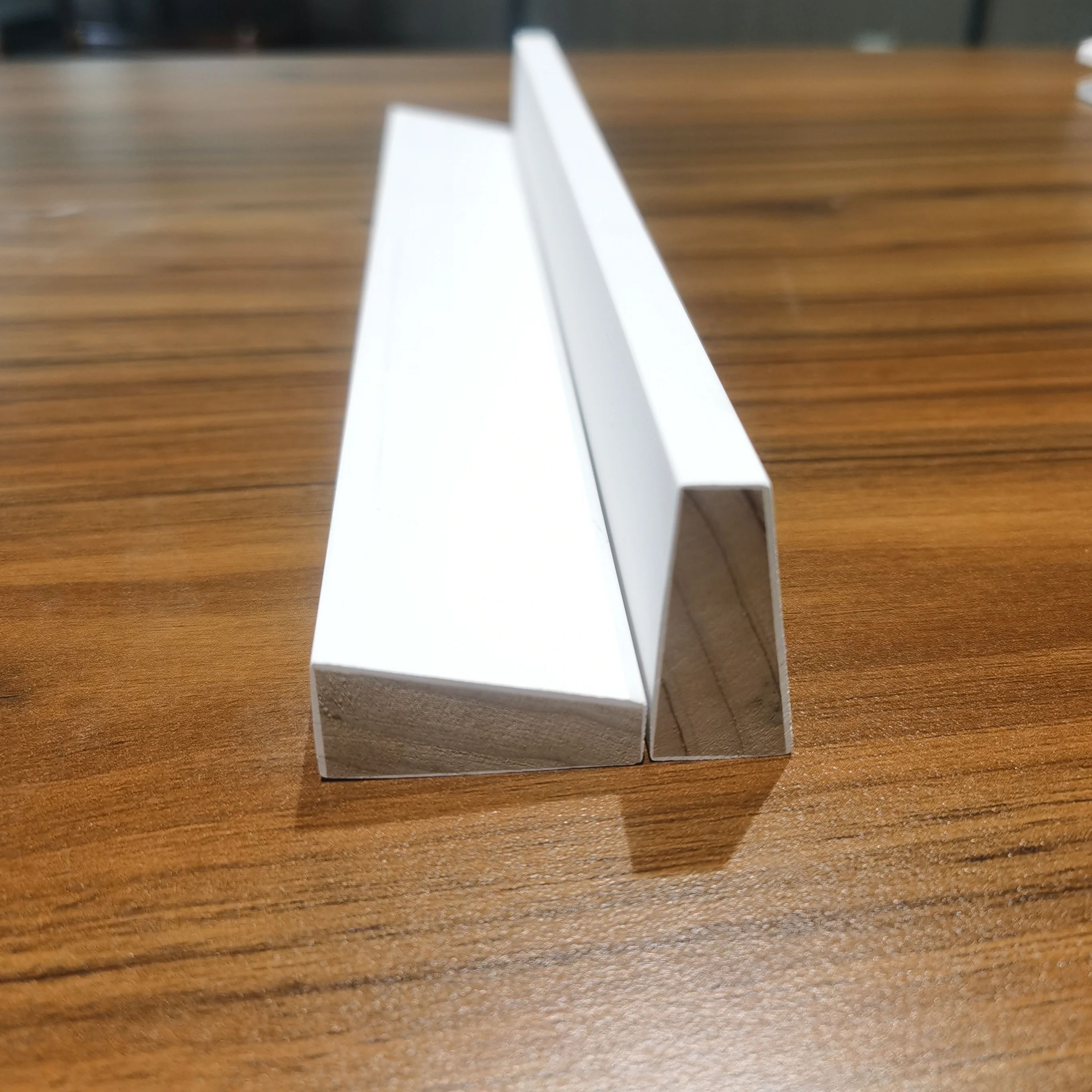 white primed wooden window sill wooden panel door skirting moulding wood frame