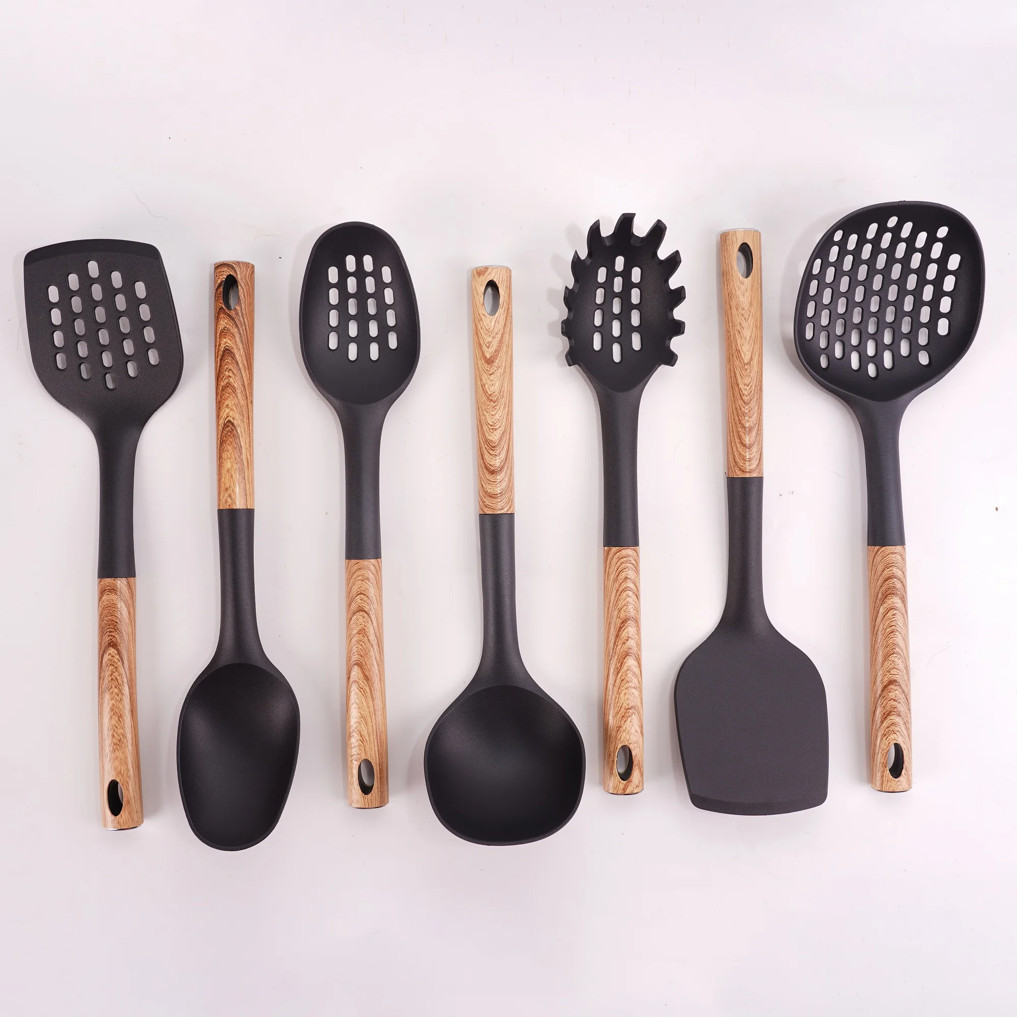 
Eco Friendly Wholesale New Product Nonstick Cookware 7 pcs Stainless steel Handle nylon Cooking Utensil Set 