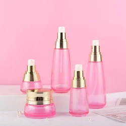 Custom cosmetic packaging transparent skin care glass bottle set with gold cap
