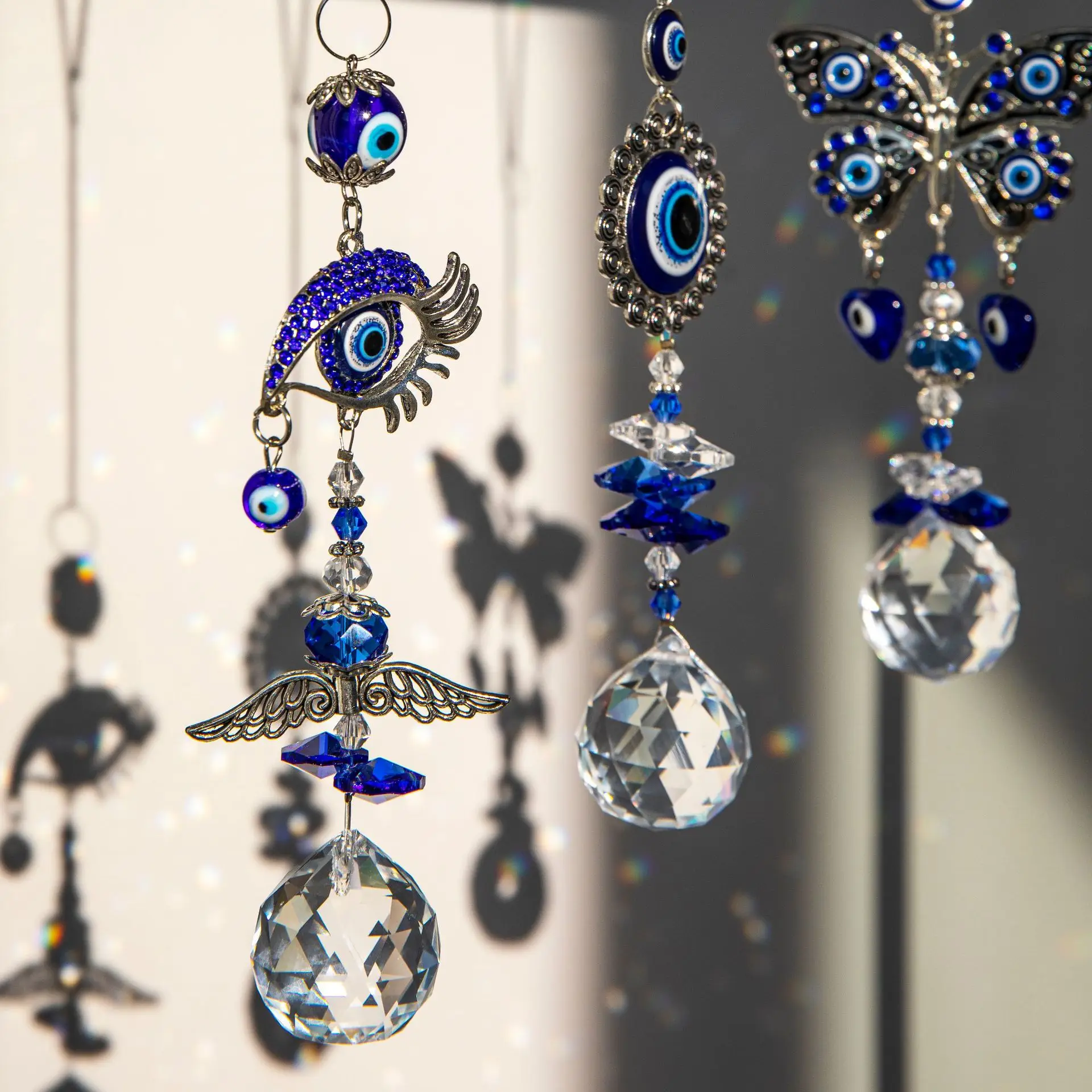 QIAO OEM/ODM Wholesale Crystal Evil Eye Light And Shadow Wind Chime  Hanging Window Gardening  Decor Sun Catcher