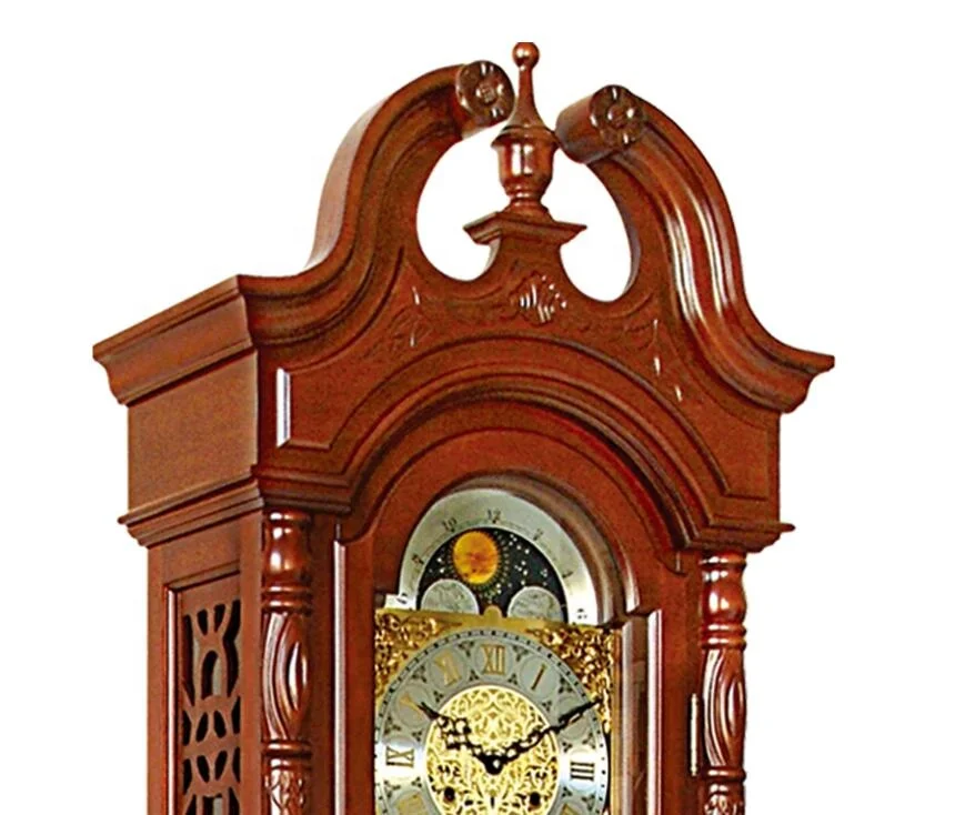 Floor Grandfather Clock the elaborate dial includes raised brass Arabic numerals, cast center and corner ornaments moon phase