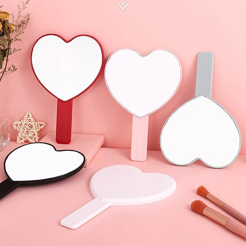 Small heart-shaped pink handheld makeup mirror beauty salon barber plastic hand mirrors portable heart-shaped mirrors for pocket