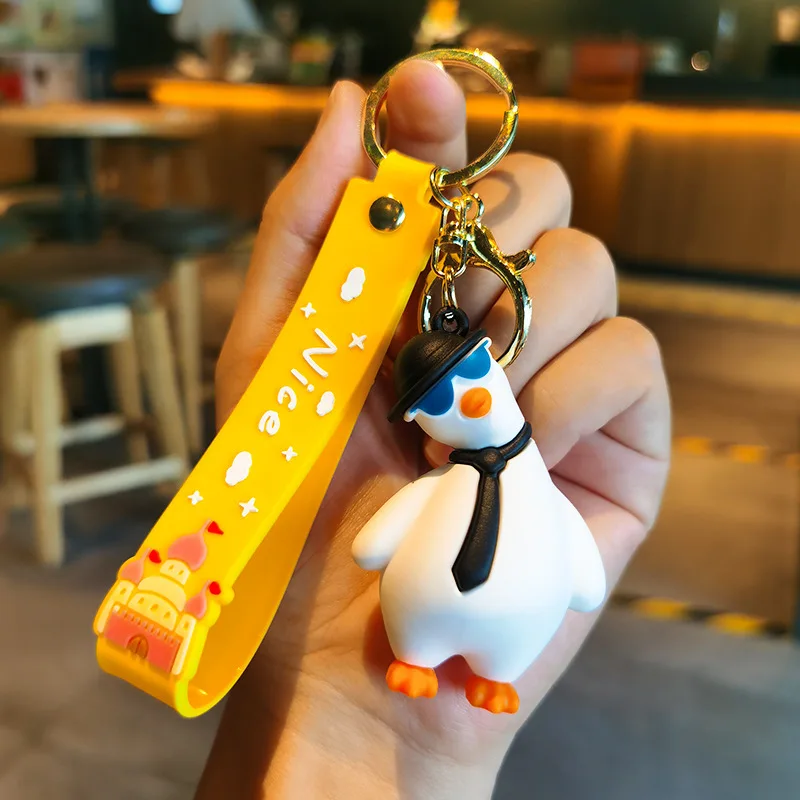 Wholesale cartoon cute funny duck soft rubber pvc keychain girl schoolbag pendant crystal key chains
