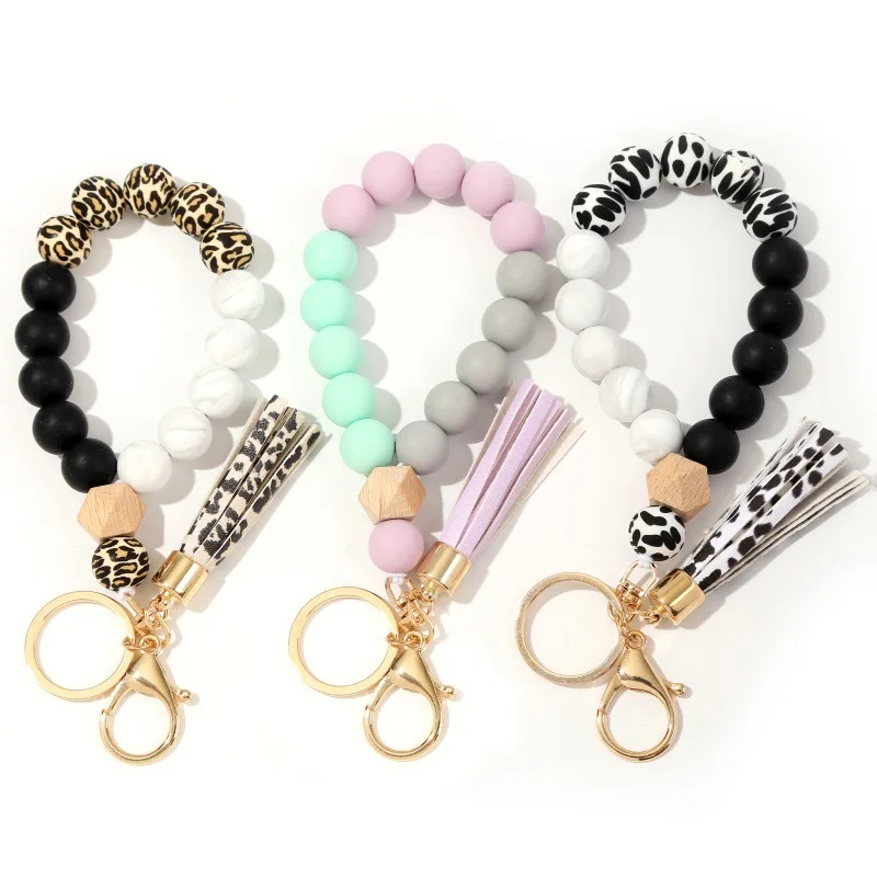 Welwish Monogram Silicone Bead Wood Bead Leo  PU Tassel Metal Keychain For Women