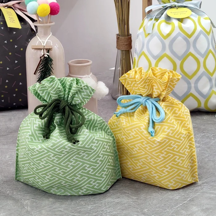 
Christmas Gift Toy Packaging Bag Non-woven Drawstring Pouches Customized Logo Printed Kids Gift Packing Bags 