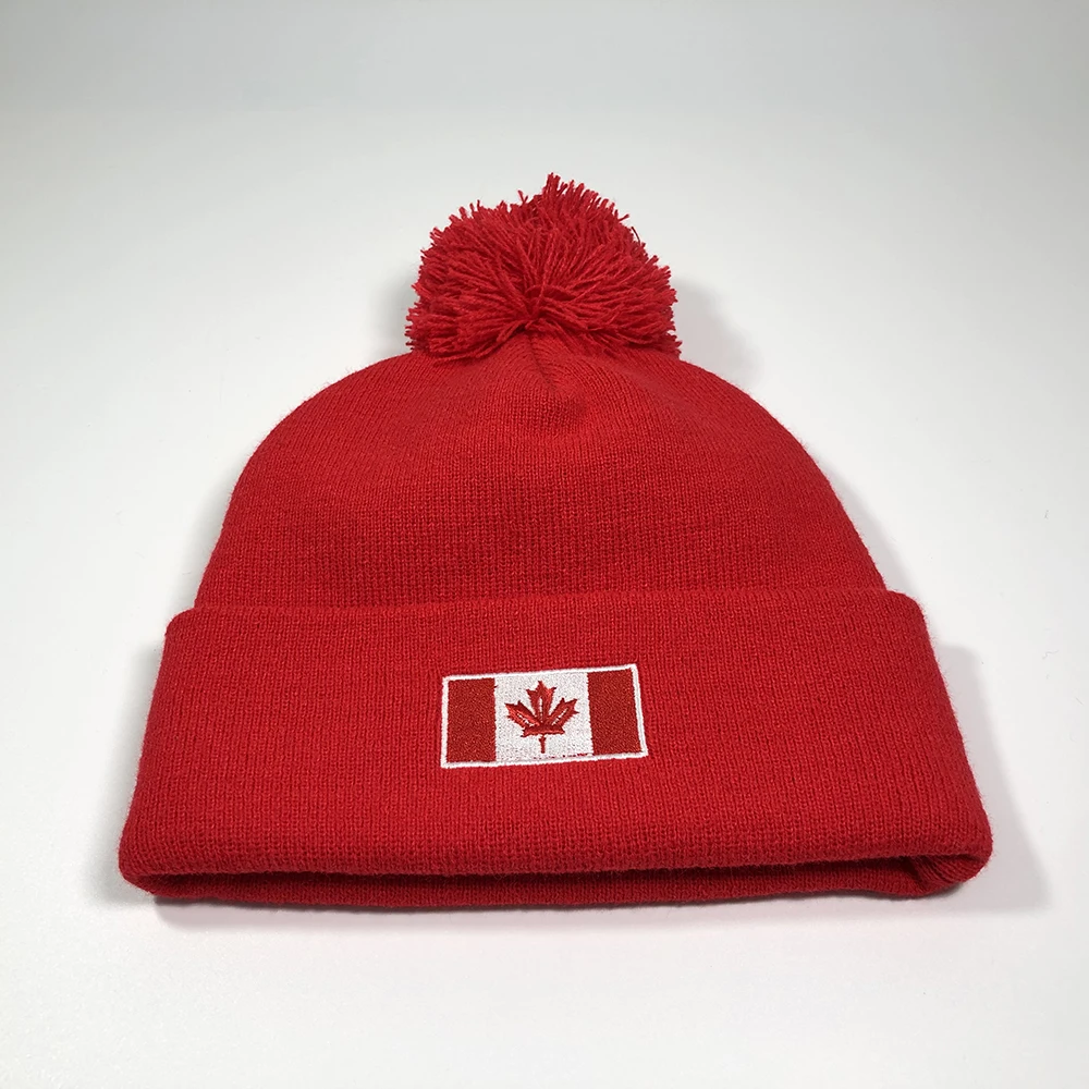 Custom Canada beanie with embroidered logo Pure red knitted pom pom winter hats Fashion adults warmer football knitted hat