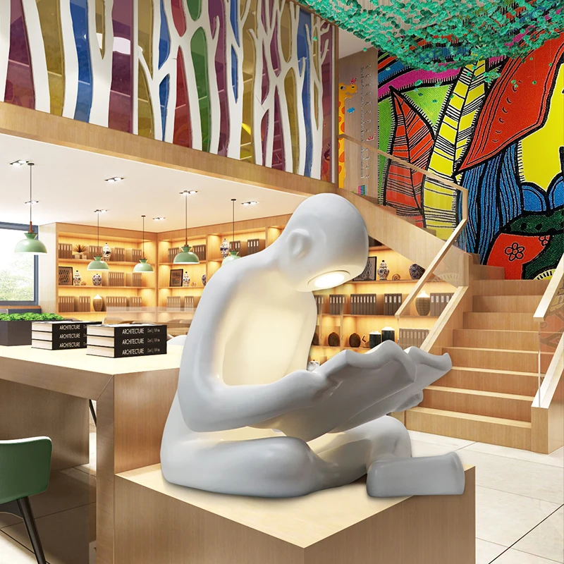 
Figurine manufacturers kid reading human sculpture for library 