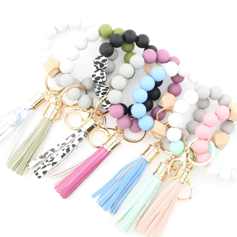2024 Hot Sale Silicone Bead Cuentas Llavero De Madera Wooden Beads Suede Circle Tassel Wristlet Keychain Bracelet