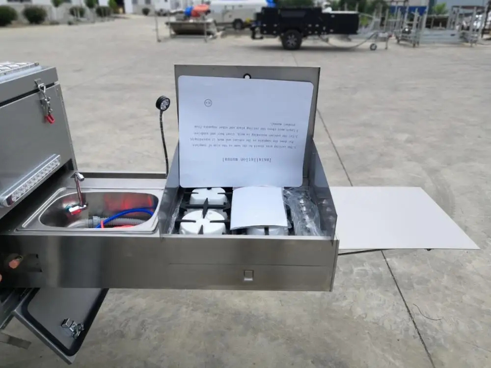 Camper trailer with stainless steel kitchen and folding tap