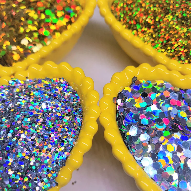 China produces cheap golden laser hexagonal sequins, happy atmosphere and colorful fragments