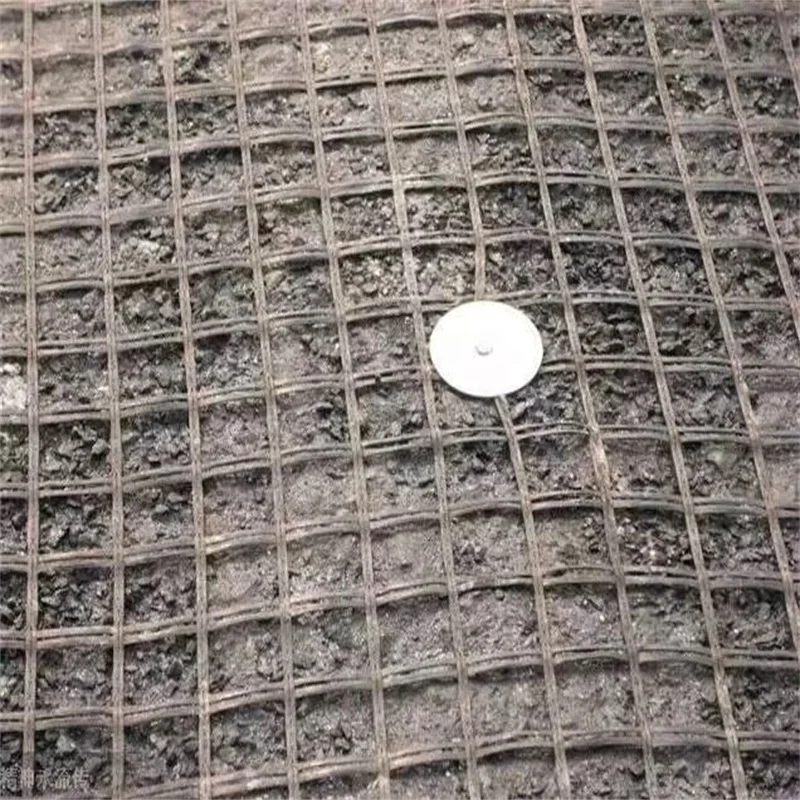 High quality Fiberglass asphalt  geogrid Fiberglass geogrid stitched nonwoven fabric fiberglass geogrid 25-260kn of manufacturer
